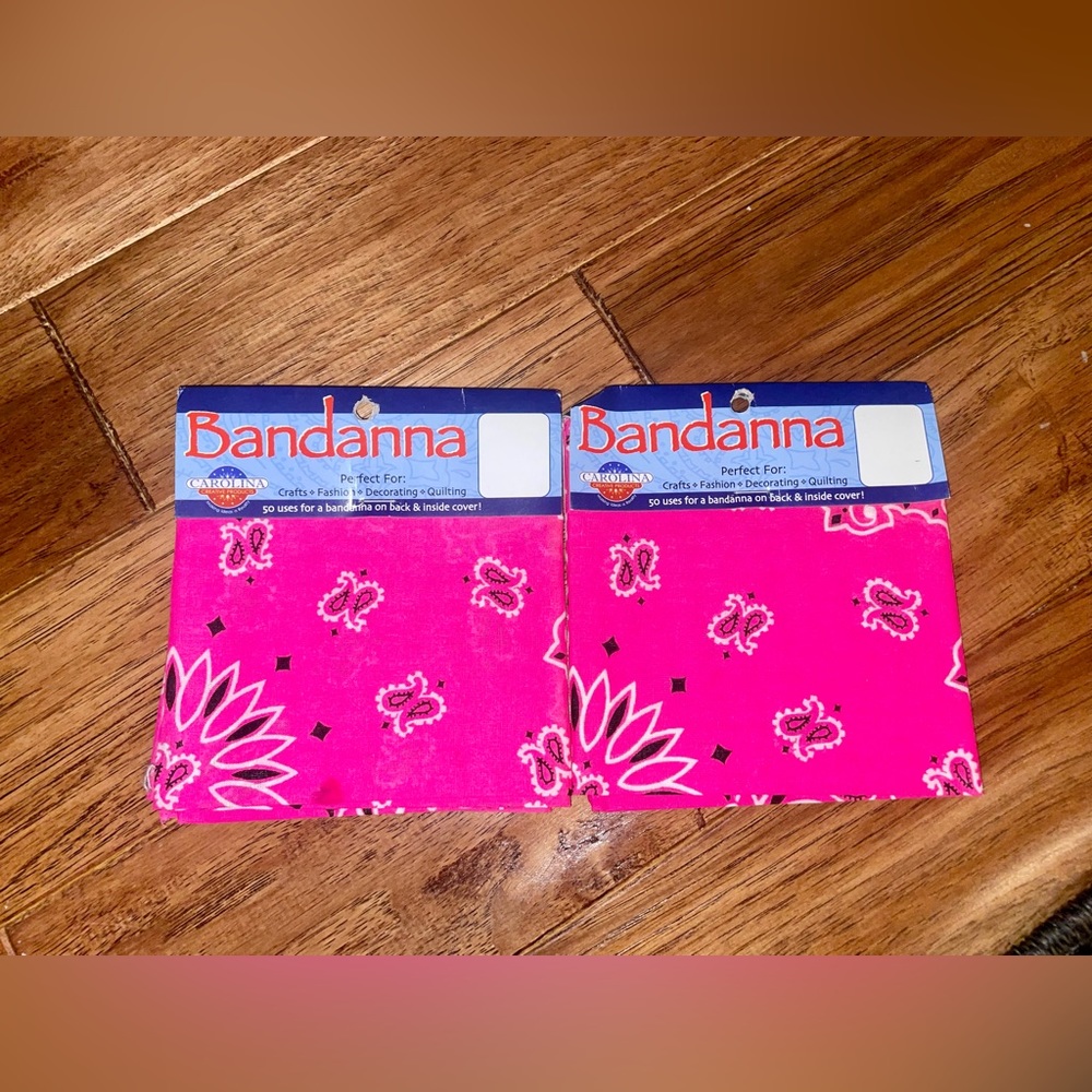 Two colorful bandannas still in package bright pink w black/ white design
